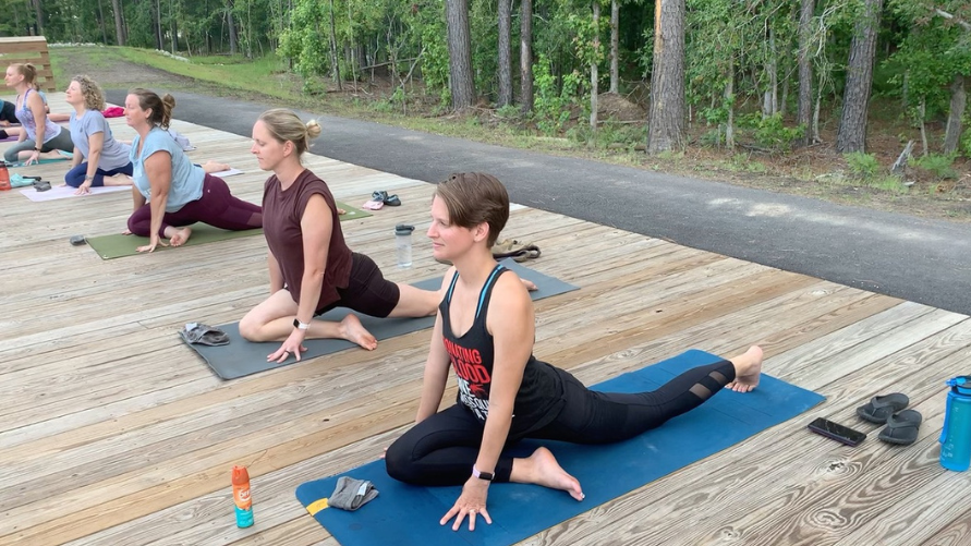 Yoga class in Pigeon Pose